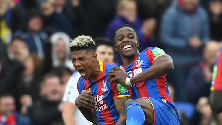 Patrick van Aanholt of Crystal Palace celebrates with Wilfried Zaha after making it 4-0