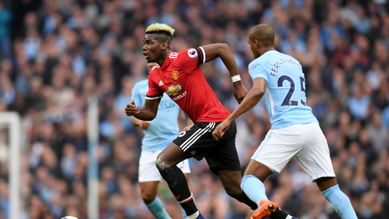 Paul Pogba surges forward during the Premier League match between Manchester City and Manchester United at the Etihad Stadium