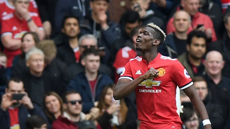Manchester United's French midfielder Paul Pogba celebrates after scoring the opening goal of the English Premier League football match between Manchester United and Arsenal at Old Trafford in Manchester, north west England, on April 29, 2018