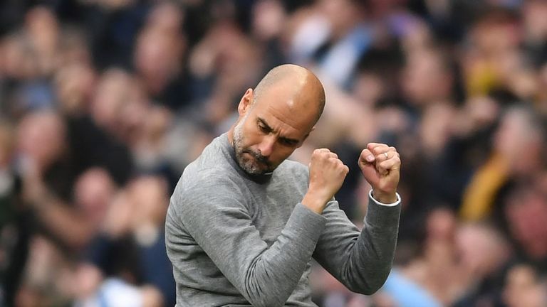 Pep Guardiola clenches his fists in celebration during the Premier League match between Manchester City and Manchester United