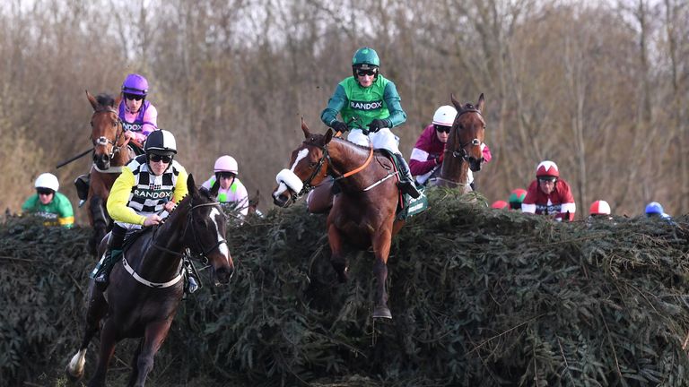 David Mullins riding Pleasant Company takes the lead as Daryl Jacob riding Ucello Conti fails to make a jump during the 2018 Randox Health Grand National at Aintree 