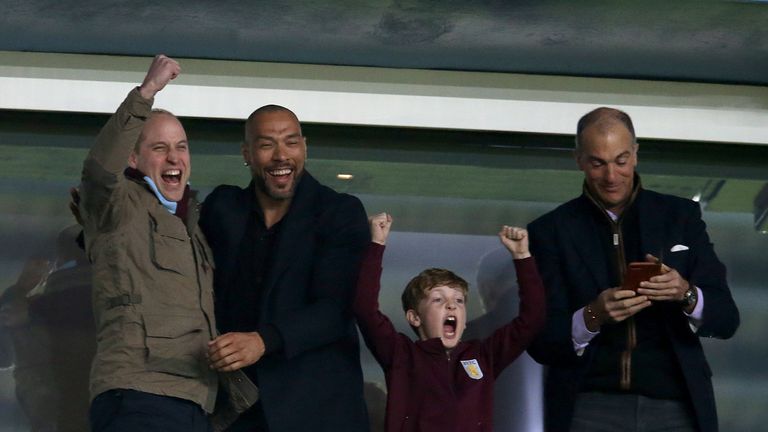 Prince William and John Carew celebrate Jack Grealish's goal for Aston Villa against Cardiff