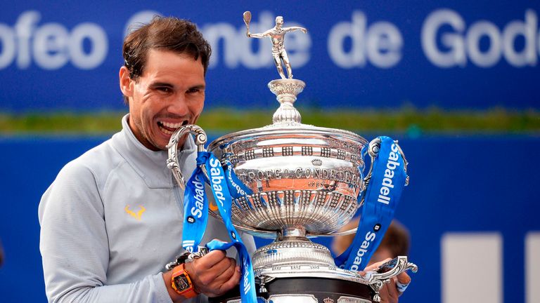 Spain's Rafael Nadal poses with his trophy after winning the Barcelona Open ATP tournament final tennis match in Barcelona on April 29, 2018