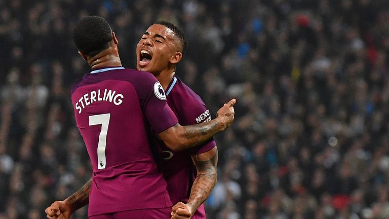 Raheem Sterling celebrates with teammate Gabriel Jesus after scoring their third goal during the Premier League match between Tottenham Hotspur and Manchester City at Wembley Stadium