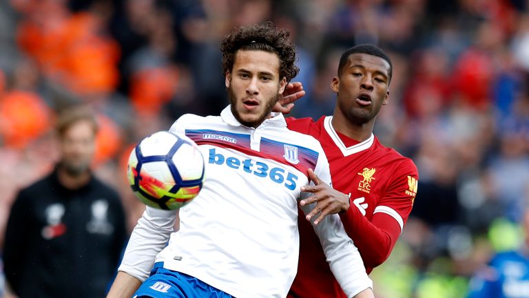 Stoke City's Ramadan Sobhi (left) and Liverpool's Georginio Wijnaldum battle for the ball during the Premier League match at Anfield, Liverpool.