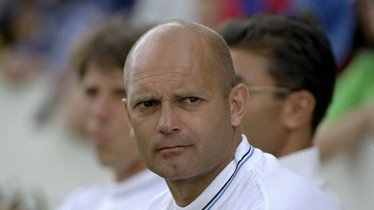 Chelsea assistant head coach Ray Wilkins watches the game from the dugout during a pre-season friendly match against Kingstonian Football Club played at Kingsmeadow in London on July 10, 1999