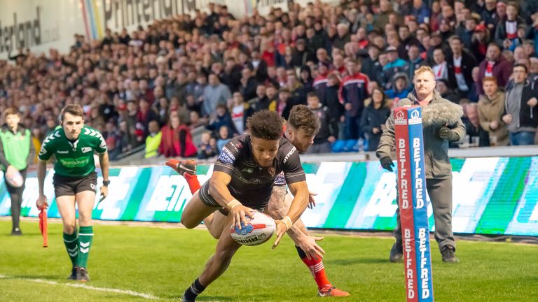 St Helens' Regan Grace dives in the corner to score a try against Salford.