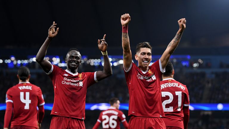 Roberto Firmino and Sadio Mane celebrate after beating Manchester City