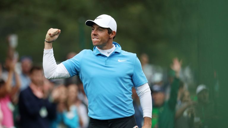 Rory McIlroy celebrates his eagle on the eighth during the third round of the 2018 Masters Tournament at Augusta National Golf Club 