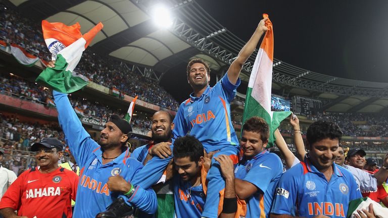 Sachin Tendulkar is carried aloft by his India team-mates in his native Mumbai