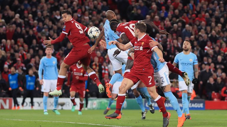 Liverpool's Sadio Mane (centre) scores his side's third goal of the game during the UEFA Champions League quarter-final, first leg match v Manchester City at Anfield