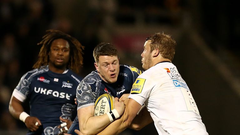 Sam James of Sale is tackled by Jimmy Gopperth and Joe Launchbury of Wasps