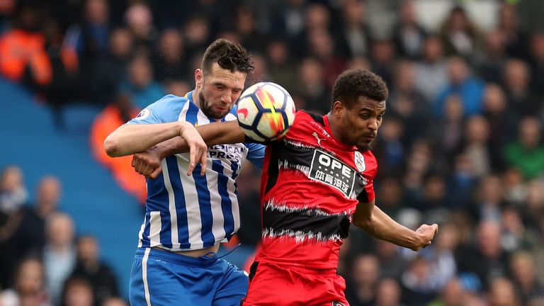 Brighton & Hove Albion's Shane Duffy and Huddersfield Town's Steve Mounie battle for the ball in the air during the Premier League match at the AMEX Stadium