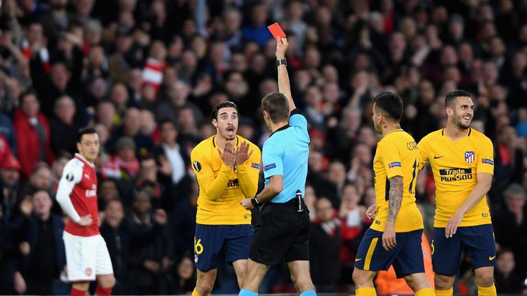  Sime Vrsaljko of Atletico Madrid is shown a red card during the Europa League semi-final against Arsenal