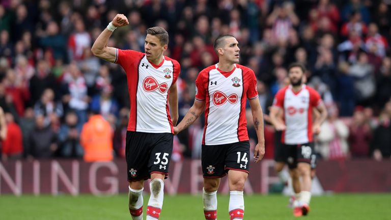 Jan Bednarek and Oriol Romeu of Southampton celebrate their side's victory following the Premier League match between Southampton and AFC Bournemouth at St Mary's Stadium on April 28, 2018 in Southampton, England