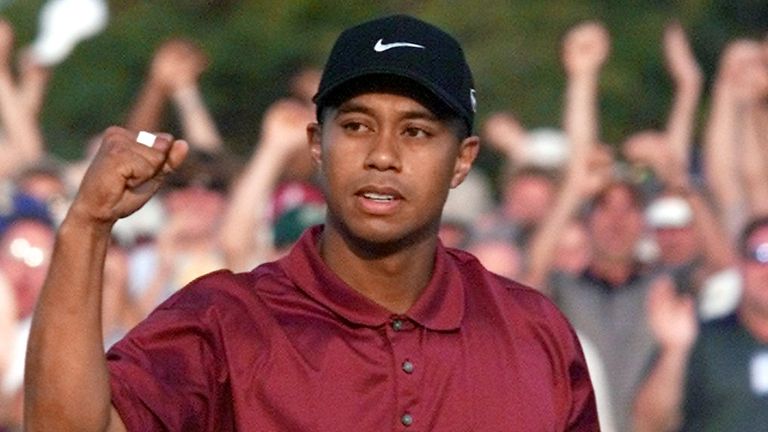 Tiger Woods punches the air after completing the 'Tiger Slam' in 2001