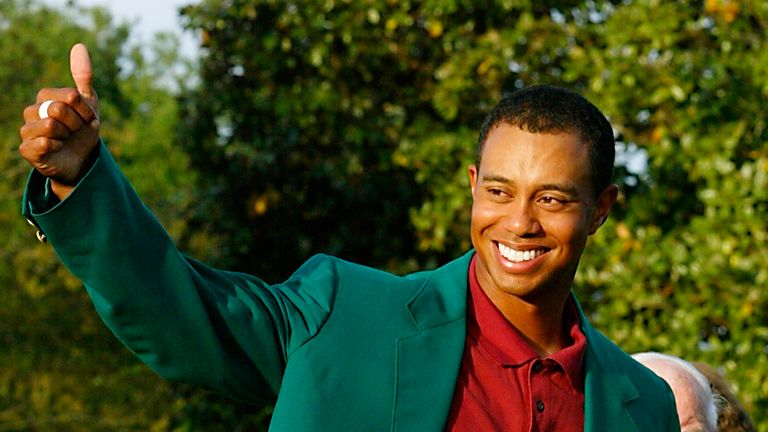 Tiger Woods gives a thumbs up to his fans after retaining the Masters title in 2002 