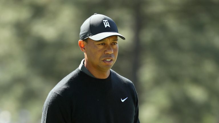 Tiger Woods looks on from the first green during round one of the 2018 Masters Tournament at Augusta