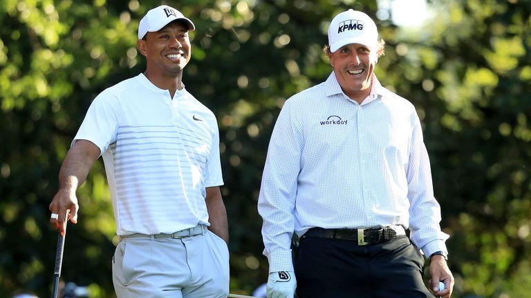 Tiger Woods and Phil Mickelson during a practice round prior to the start of the 2018 Masters Tournament at Augusta National