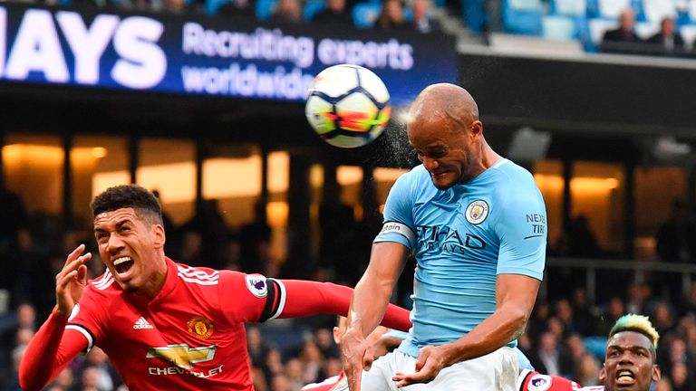 Vincent Kompany gets away from his marker, Chris Smalling to make it 1-0