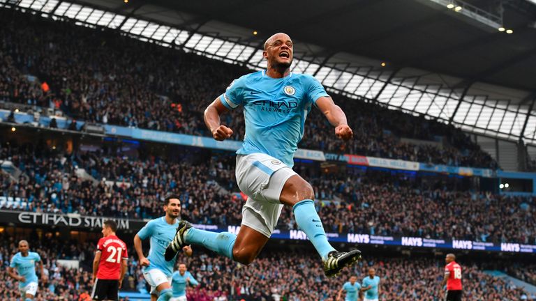 Vincent Kompany celebrates scoring the opening goal during the Manchester derby at the Etihad Stadium
