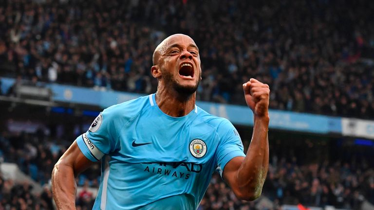 Vincent Kompany celebrates scoring the opening goal of the Manchester derby at the Etihad Stadium