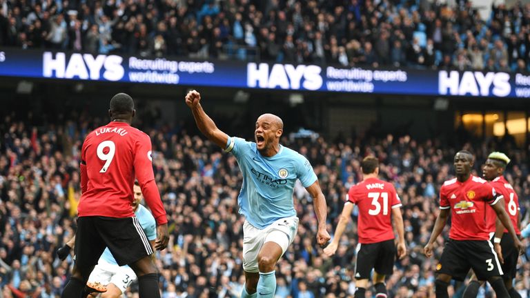 Vincent Kompany celebrates scoring his side's first goal during the Premier League match between Manchester City and Manchester United at Etihad Stadium on April 7, 2018