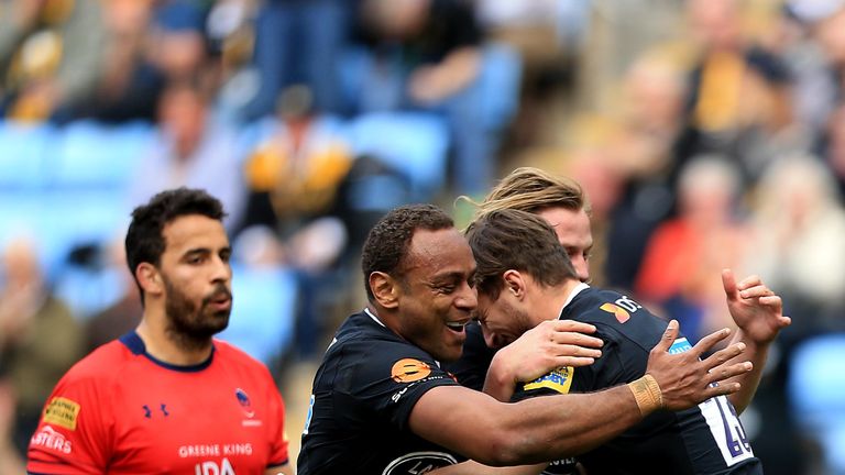 Josh Bassett celebrates scoring a try for Wasps