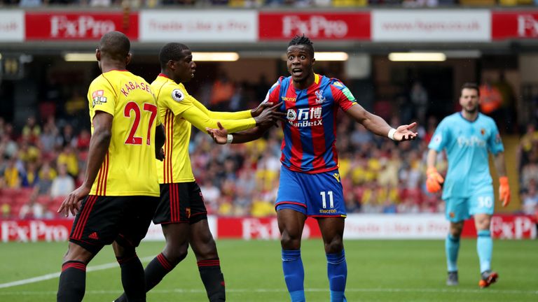 Abdoulaye Doucoure confronted Wilfried Zaha after the first penalty shout