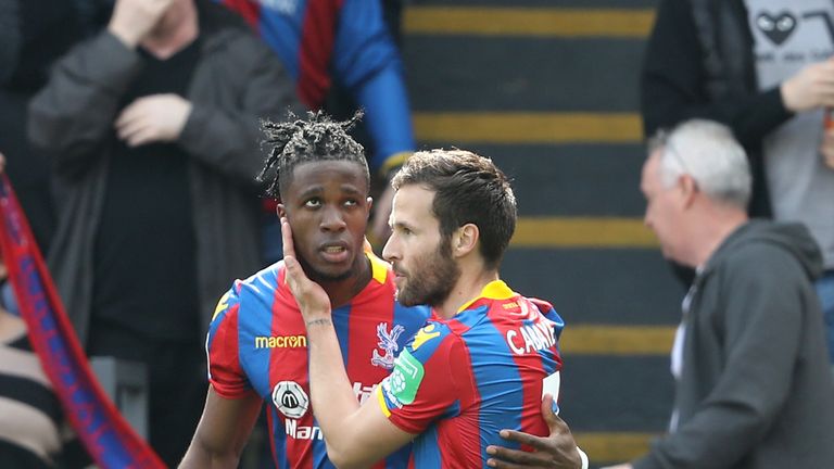 Wilfried Zaha celebrates with teammate Yohan Cabaye after opening the scoring in the Premier League match against Brighton at Selhurst Park
