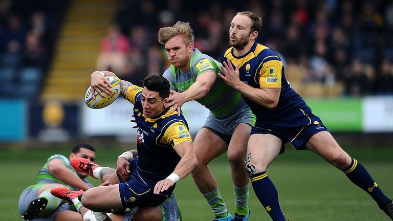 Bryce Heem of Worcester Warriors is tackled by Nili Latu of Newcastle Falcons