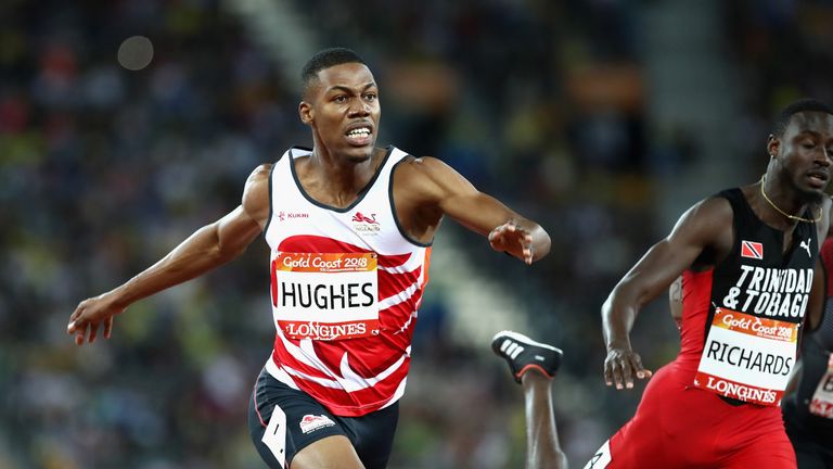 Zharnel Hughes of England crosses the line ahead of Jereem Richards of Trinidad and Tobago