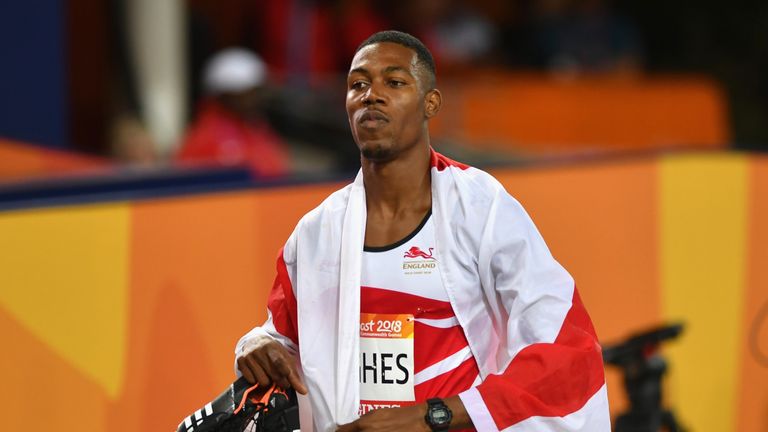 Zharnel Hughes exits the stadium after learning he has been disqualified