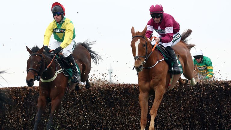 Finian's Oscar (left) on his way to victory at Aintree