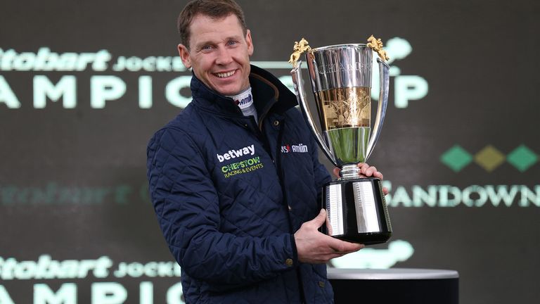 Richard Johnson with the 2017-18 Champion Jockey trophy