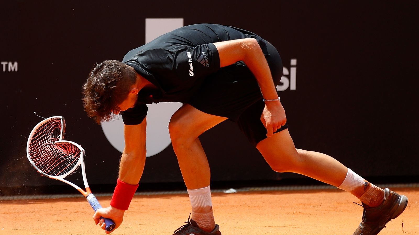 Dominic Thiem annihilates his racket after losing to Fabio Fognini in