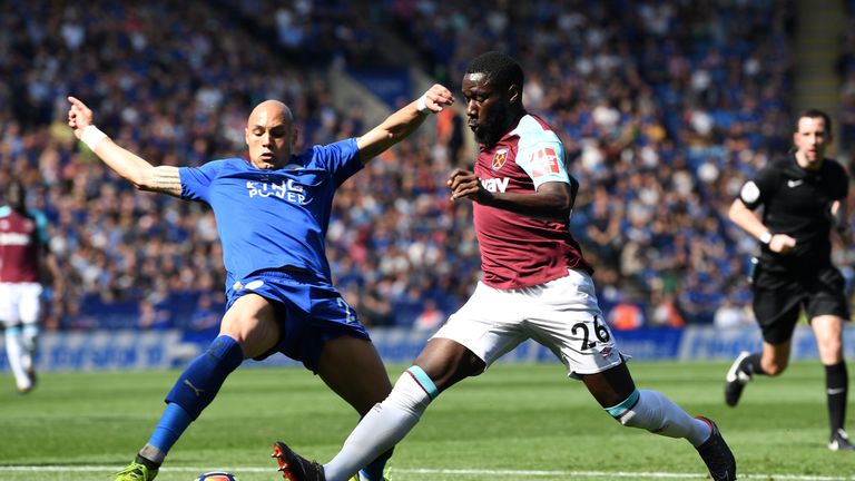 Arthur Masuaku is challenged by Yohan Benalouane