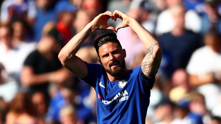 Olivier Giroud salutes the fans after opening the scoring at Stamford Bridge