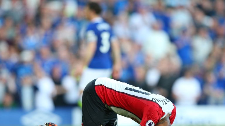 Ryan Bertrand falls to the turf following Tom Davies' injury-time equaliser