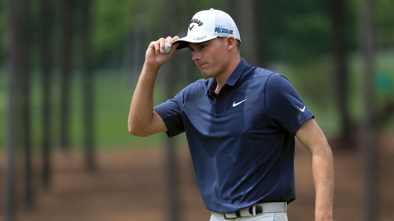 Aaron Wise acknowledges the gallery following a putt on the fifth green during the third round of the 2018 Wells Fargo Championship at Quail Hollow Club