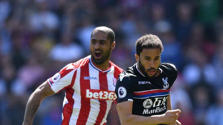 Andros Townsend and Glen Johnson battle for the ball during Stoke's match against Crystal Palace