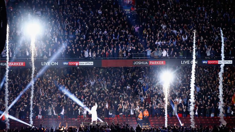 Anthony Joshua walks to the ring prior to his WBA, IBF, WBO heavyweight Championship title fight against Joseph Parker at Principality Stadium on March 31, 2018