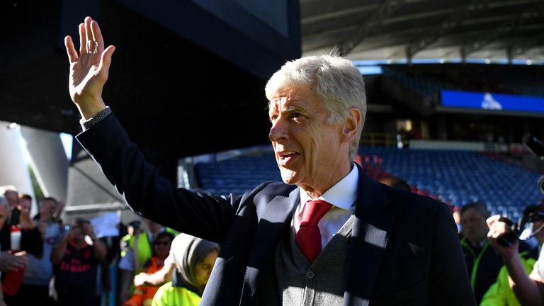 Arsene Wenger waves goodbye to the Arsenal fans after his final game in charge