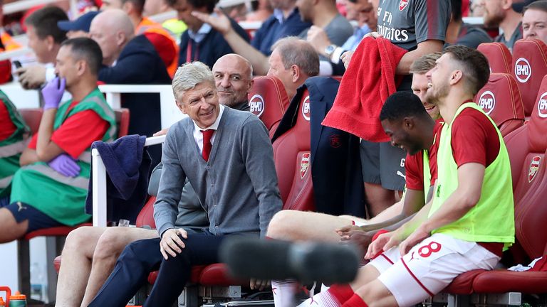 Arsene Wenger shares a joke with his players