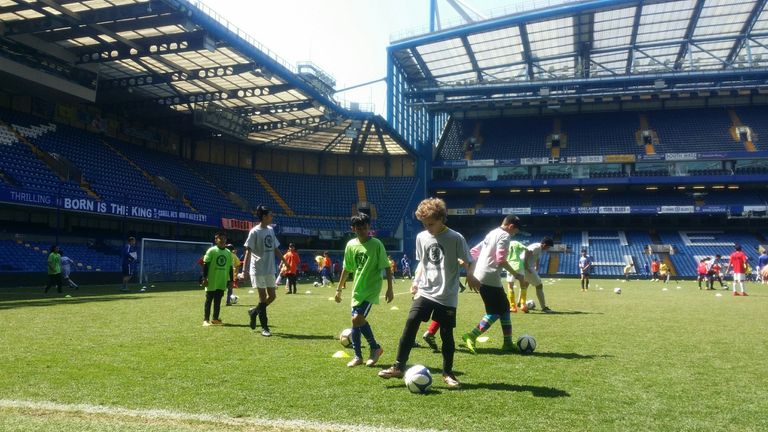 Budding footballers hone their skills at Chelsea's Stamford Bridge stadium