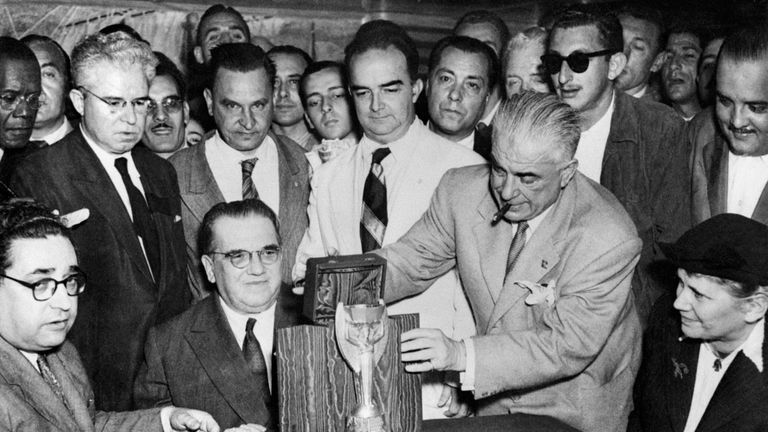 Representatives of the Italian football federation present the Jules Rimet Cup to their Brazilian counterparts 22 June 1950 in Rio de Janeiro, two days before the start of the fourth World Cup in Brazil