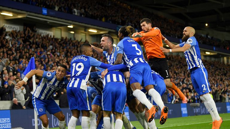 Pascal Gross celebrates his goal with team-mates during the Premier League match between Brighton and Hove Albion and Manchester United at Amex Stadium on May 4, 2018 in Brighton, England.