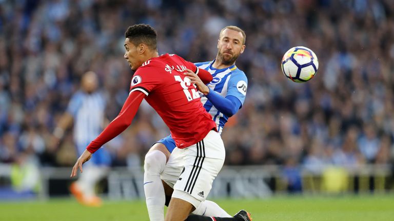 Chris Smalling and Glenn Murray during the Premier League match between Brighton and Hove Albion and Manchester United at Amex Stadium on May 4, 2018 in Brighton, England.