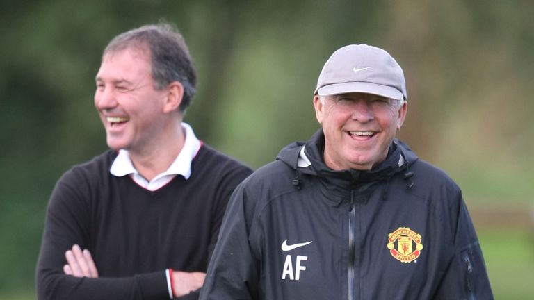 Bryan Robson and Sir Alex Ferguson share a joke at Carrington Training Ground on September 26 2011.