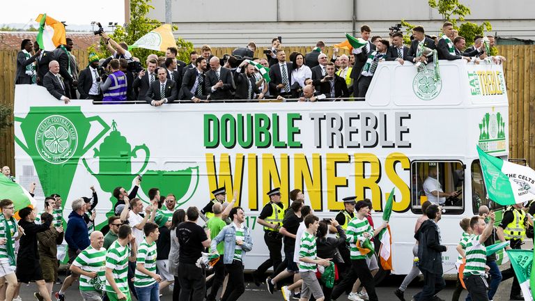 Celtic players celebrate on the streets of Glasgow